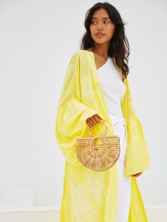 This marvelous Miko - Yellow Kimono Robe & Jacket is an excellent way to effortlessly bring impact to your look. Featuring a relaxed oversized fit in a handmade breathable fabric and enlivened with a cool yellow hue, this kimono will lift any outfit. Features: Soft feel Lightweight feel Very comfortable Handmade Oversized fit Puffy sleeves Oversized -One size all fit Removable waist tie closure with loops Side slits at hem No pockets Hand wash in cold water, hang dry Size + Fit Model height is w Oversized Bohemian Outerwear For Day Out, Bohemian Oversized Outerwear For Day Out, Chic Relaxed Fit Summer Outerwear, Casual Beach Outerwear, Trendy Cotton Beach Outerwear, Casual Cotton Beach Outerwear, Beach Outerwear With Relaxed Fit And Long Sleeves, Relaxed Fit Long Sleeve Beach Outerwear, Yellow Summer Outerwear For Day Out