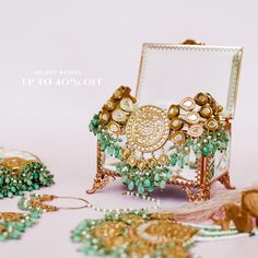 Leave an everlasting impression in our signature Samahir Set! The intricate and dainty details on this traditional set has surely left us in awe! This classic and traditional set includes a choker and a big mala both heavily studded with gutka kundan and clusters of dangling green beads. The set includes a choker paired with a mala, a maang teekah, a jhoomar, a nosering, a finger ring and a pair of matching earrings. Approximate earrings length is 3". Gold-plated on high-quality brass as base me Green Beads, Mala Necklace, Faux Stone, Finger Ring, Ring Finger, Green Bead, Base Metal, Matching Earrings, Free Gifts