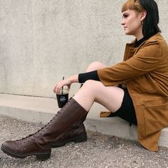 This brown knee-high boot has all the class of a riding boot but all the street cred of a combat boot! You can't go wrong with a pair of these boots that are a proven fan favorite. Rocket Dog women's boot Brown faux leather upper Brown shoe laces Studded details Slight chunky heel Rounded toe Thick rubber sole Heel height 2 inches Platform height 1 inch Shaft height 13 inches Knee High Brown Boots Lace Up, Brown Lace Up Boots Outfit, Lace Up Boot Outfit, Brown Lace Boots, Dark Brown Shoes, Brown Knee High Boots, Brown Boots Women, Tall Boot, Rocket Dog