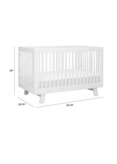 a white crib is shown with measurements