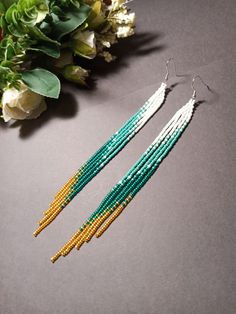 "These turquoise white gold long fringe bead earrings pair amazingly with any outfit, dressy or casual. They are made of high-quality Czech colored beads with steel . Colors: turquoise white gold Length: 6.3 inches (16 cm) Width: 0.5 inches (1 cm) Materials: Czech \"Preciosa\" beads Durable synthetic thread" Extra Long Beaded Earrings, Long Bead Earrings, Long Beaded Fringe Earrings, Long Fringe Earrings, Long Seed Bead Earrings, Fringe Beaded Earrings, Long Beaded Earrings, Extra Long Earrings, Diy Seed Bead Earrings