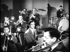 a group of men in suits and ties playing musical instruments