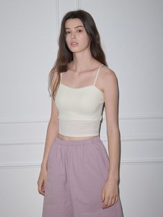 This tank top is a versatile item that can be styled with any bottom and be layered with any shirts or outers, exuding basic and modern mood.- Available in 2 basic colors: white and black- Features a built-in chest cap for added style- Made from a soft and stretchy fabric blend of cotton and spandex Best Tank Tops, Black Features, Cami Tanks, Basic Colors, Stretchy Fabric, 2 Colours, White And Black, Built In, Tank Top