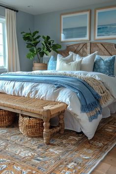 a bedroom with a large bed and two baskets on the floor in front of it