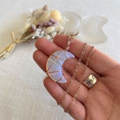 Our beautifully unique Opalite Crescent Moon pendant will make a gorgeous addition to any boho wardrobe.  The polished Opalite is wire-wrapped in tarnish-resistant rose gold wire and comes on a rose gold plated chain.  Pendant is reversible. Pendant dimensions ~ Approx. 40mm x 25mm  Opailite is said to stabilize mood swings, bring inner peace and a sense of calm in any situation. The crescent moon is thought to bring a new lease of energy and positivity, giving us the motivation to achieve our d Bohemian Moon-shaped Crystal Necklaces As Gift, Bohemian Moon Crystal Necklaces For Gift, Bohemian Moon-shaped Crystal Necklaces For Gift, Bohemian Moon Crystal Necklace Gift, Bohemian Moon-shaped Crystal Necklace Gift, Bohemian Rose Gold Hand-wrapped Necklace, Bohemian Rose Gold Hand Wrapped Jewelry, Wire Wrapped Crystals, Opalite Jewelry