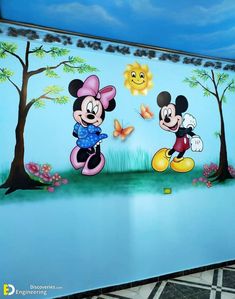 mickey and minnie mouse mural on the side of a building