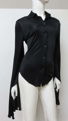 For Sale on 1stDibs - A fabulous black fine stretch silk shirt, top, blouse from Tom Ford for Gucci. It is semi fitted with a shirt collar, black mother of pearl Gucci inscribed Elegant Gucci Blouse For Evening, Elegant Gucci Blouse For Party, Gucci Formal Button-up Blouse, Elegant Gucci Party Blouse, Gucci Button-up Blouse For Formal Occasions, Gucci Collared Blouse For Formal Occasions, Gucci Black Top For Night Out, Gucci Formal Collared Blouse, Elegant Gucci Button-up Blouse