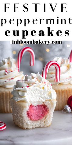 some cupcakes with white frosting and candy canes