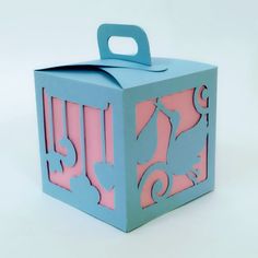 a blue and pink box with an animal design on the front, sitting on a white surface