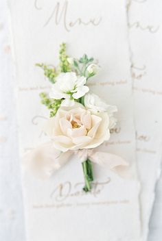 a close up of two napkins with flowers on them and the words menu written in cursive writing