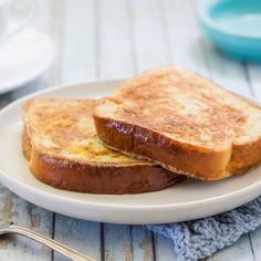 two pieces of toast on a white plate