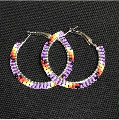 Purple Beaded Hoop Earrings Colorful Beads Hoop Earrings, Small Hoop Earrings With Tiny Beads For Festivals, Festival Small Hoop Earrings With Dangling Beads, Purple Beaded Hoop Earrings With Round Beads, Colorful Beaded Circle Earrings, Festival Beaded Hoop Earrings With Dangling Beads, Circular Beaded Earrings For Festivals, Purple Bohemian Hoop Earrings, Purple Beaded Round Hoop Earrings