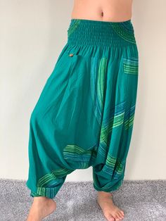 "⬇️ SHOP HERE https://www.etsy.com/ch-en/shop/IndycraftsDesigns Aladdin Pants, Harem Pants 100% Cotton Unisex pants, perfect for yoga, The pants have smock waist (wide bang elastic) The fabric is cotton soft, lightweight, and airy, ideal for those warm days. If it's a bit chilly, you could always wear leggings underneath. super comfortable cotton pants made of light, comfortable to wear cotton. The ideal pants for leisure, sport and wherever it should be loose and comfortable *Special features: Bohemian Cotton Hip-length Bottoms, Green Wide Leg Bottoms For Festivals, Green Wide Leg Festival Bottoms, High Waist Green Cotton Harem Pants, Green Full-length Pants For Festivals, Full-length Green Pants For Festivals, Green Cotton Festival Bottoms, Green Full Length Pants For Festival, Green Bohemian Cotton Bottoms