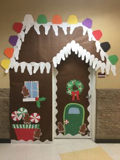 two decorated gingerbread houses on the wall