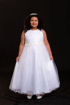 Full length dress with elegant bridal lace bodice and shimmery tulle skirt is detailed with an intricate trim of flowers, pearls, rhinestones, and ribbons on the waist. 100% Polyester Lining: Satin & Poly Lining Tulle Hard Net for Extra Skirt Volume Zip Fastening Sash for Tightening Full Length Dry Clean Only Made in USA First Communion Dress, Tulle Flower Girl, Tulle Flowers, Girls Formal Dresses, Flower Girl Dresses Tulle, Full Length Dress, Lace Bodice, Bridal Lace, Custom Dresses