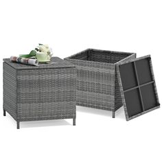 two grey wicker boxes with one open and the other closed, both side by side