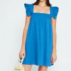 Brand New. Blue. This Perfect Spring Frock Is Made From A Breezy Linen Blend. Done With A Relaxed Fit And Structural Square Neckline To Contrast The Exaggerated Ruffled Sleeves. - Pockets - Lined - Content: 70% Cotton, 30%, Linen No Trades/Paypal. Blue Mini Dress For Daywear, Blue Square Neck Sundress For Brunch, Blue Cotton Square Neck Sundress, Chic Blue Cotton Dress, Blue Square Neck Sundress, Blue Square Neck Vacation Dress, Chic Blue Square Neck Sundress, Chic Blue Mini Dress With Square Neck, Blue Cotton Mini Dress With Square Neck