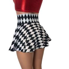 Our newest skirt style! We are in love with this lace-up, open-front mini skirt in black and white diamond harlequin print with metallic red ties on the corset waistband. The tie-up front offers an adjustable fit and the skirt is a single layer. Retro Mini Length Party Bottoms, Retro Mini Skirt For Parties, Retro Party Mini Skirt, Fitted Mini Length Bottoms For Costume Party, Fitted Mini Skirt For Cheerleading, Fitted Cheerleading Mini Skirt, Fitted Pleated Mini Skirt For Cheerleading, Fitted Black Mini Skirt For Cheerleading, Black Fitted Mini Skirt For Cheerleading