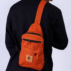 This crossbody bag is your ultimate adventure buddy for both city excursions or the outdoors. Made with ethically-sourced water-resistant canvas, it has clips on both sides so you can wear it over your left or right shoulder, front or back.   Inside, you'll discover a spacious main compartment with a convenient divider, plus two handy pockets on the front for quick access. Oh, and here's the kicker: there's even a sneaky hidden zippered pocket in the back for some extra security. ✔Crafted from 1 Canvas Shoulder Bag Backpack For Outdoor Activities, Outdoor Canvas Backpack With Adjustable Strap, Practical Canvas Bag With Adjustable Strap For Outdoor, Casual Adventure Backpack Shoulder Bag, Casual Shoulder Bag With Ykk Zipper For Outdoor, Functional Outdoor Canvas Bag With Adjustable Strap, Crossbody Backpack With Pockets For Outdoor Activities, Outdoor Crossbody Backpack With Pockets, Shoulder Bag With Water Bottle Pocket For Outdoor Activities