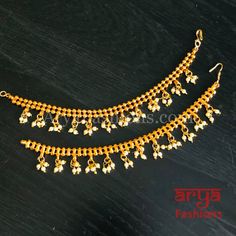 Golden beads Earring Chain/ Pearl Beads Extender Chain / Earring Extension Made in Brass with 22 Karat Gold Plating Made with Pearls Length: 4.5 to 5 Inches with a Hook Lightweight Earrings Extension Suitable for any type of Earrings Diwali Gold Jewelry With Dangling Beads, Bollywood Style Gold Danglers With Dangling Beads, Gold Danglers With Dangling Beads For Festivals, Traditional Gold Plated Earrings With Pearl Chain, Traditional Gold Dangling Beads, Earring Chain, Golden Beads, Chain Earring, Types Of Earrings