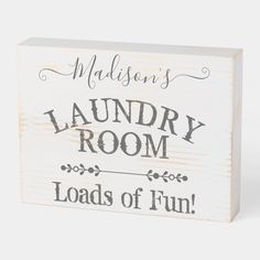 a wooden sign that says madison's laundry room loads of fun