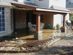 a house that has some water on the ground in front of it and is flooded