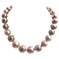 Description A truly stunning necklace showcasing large 13 to 15 mm semi-baroque freshwater pearls in a unique harmonized variation of natural pink hues, with an unparalleled luster that adds to its timeless beauty. Item # N3768 For a complete look, pair it with matching earrings (Item # E3403) see photos, sold separately. Materials and Weight Nucleated freshwater pearls, 13-15mm, 26 pearls, semi-baroque shapes 14k yellow gold clasp Dimensions Length 17 inches. Made in Newport Beach, California. Newport Beach California, Beach California, Stunning Necklace, Newport Beach, Matching Earrings, Newport, Timeless Beauty, See Photo, Fresh Water