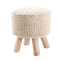 an upholstered stool with wooden legs and a white knitted cover on top