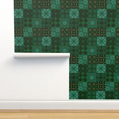 a wall with a green pattern on it