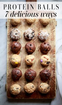 a wooden board topped with chocolate chip cookies