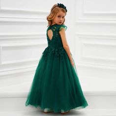 No color says “her majesty is ready for a ball” like the emerald green in our Joan lace gown for girls! This rich and deep hue is a welcome choice for girls who want something a little more vibrant than a delicate white or pink formal dress. Impeccable Style for Her Big Event Our Joan gown is ideal for any little girl with a fancy event such as a wedding, church event or Christmas party lined up! It’s covered in stylish details such as tulle cap sleeves, French lace flowers all over the front, a Princess Style Green Ball Gown For Pageant, Green Christmas Princess Dress For Dress-up, Fitted Green Ball Gown For Dress-up, Green Princess Gown For Pageants, Green Princess Dress For Pageants, Green Princess Gown For Pageant, Green Princess Dress For Pageant, Princess Style Green Gown For Pageant, Green Princess Style Tulle Dress