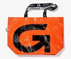 an orange bag with the letter g on it