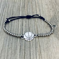 🏀BASKETBALL BRACELET - Silver Beads with Basketball Charm on Adjustable Bracelet 🏀ADJUSTABLE - Basketball bracelet is adjustable. Easily Adjusts to Fit your Wrist 5" to 8" *will fit most wrists sizes small to large 🏀BASKETBALL GIFT - Looking for an inexpensive Basketball gift ? Got a birthday, holiday, or other special occasion coming up for the Basketball player in your life? This high quality yet inexpensive bracelet makes a great gift, whether for a friend, daughter, girlfriend, or teammat Sporty Beaded Bracelets For Sports Events, Sporty Bracelets With Round Beads For Sports Events, Casual Round Beads Bracelets For Sports Events, Adjustable Sporty Wristband For Sports, Sporty Adjustable Beaded Bracelets For Game Day, Adjustable Sporty Beaded Bracelets For Game Day, Sporty Adjustable Stretch Bracelet For Game Day, Nickel Free Adjustable Charm Bracelet With Round Beads, Adjustable Nickel-free Charm Bracelet With Round Beads