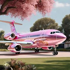 a pink plane is parked on the tarmac with cherry blossoms in the foreground