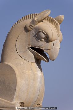 a statue of a horse with its mouth open and it's eyes wide open