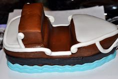 a cake shaped like a boat on top of a table