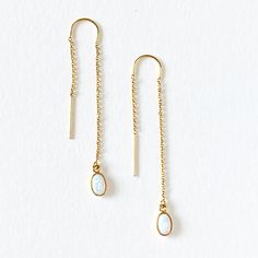 "These 14kt gold-filled thread earrings are dainty and delicate. Choose from a tear drop druzy (aqua, pink, white, blue & black), gold crescent moon, opal, oval cz, pearl, pearl & opal and star & opal. DETAILS & SIZE *The listing is for one pair of threader earrings *Available in our high shine 14kt gold filled *Length: 2.5\" - 3\" *Every purchase comes in a Tangerine branded gift box. *Handcrafted with care in Seattle WA *We LOVE what we create and want you to equally LOVE your Yellow Gold 14k Gold Filled Threader Drop Earrings, Hypoallergenic Yellow Gold Threader Drop Earrings, 14k Gold Tarnish Resistant Threader Drop Earrings, 14k Gold Tarnish-resistant Threader Drop Earrings, 14k Gold Tarnish-resistant Drop Threader Earrings, Dainty Teardrop Earrings With Delicate Chain, Dainty Gold Plated Threader Earrings, 14k Gold Filled Drop Earrings With Adjustable Chain, 14k Gold-filled Drop Earrings With Adjustable Chain