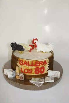 a cake decorated with roosters and other decorations