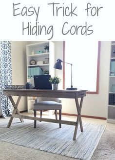 a desk with a laptop on it and the words easy trick for hiding cords above it