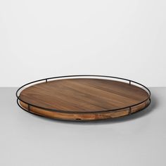 a wooden tray with metal trim around it