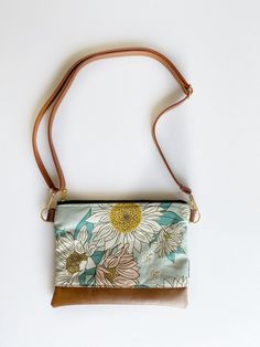 "Made to order! Small crossbody bag with a roomy and organized interior! This size is perfect for traveling when you need to carry the essentials. The crossbody strap can be removed and the purse can be used as a clutch! Interior will be a coordinating print of a fabric that I have in stock. If you would like a specific print, please message me ahead of ordering.  Specs: Approx 8\"x10\" Faux crossbody strap Faux brown bottom 2 card slots 1 phone pocket Gold metal zipper and hardware" Turquoise Shoulder Bag With Removable Pouch For Everyday, Turquoise Shoulder Bag With Removable Pouch, Turquoise Everyday Crossbody Bag, Turquoise Shoulder Bag With Detachable Strap For Everyday, Turquoise Crossbody Bag For Everyday Use, Turquoise Everyday Pouch Shoulder Bag, Turquoise Crossbody Bag With Adjustable Strap, Everyday Turquoise Shoulder Bag With Adjustable Strap, Turquoise Everyday Bag With Adjustable Strap