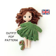 a crocheted doll with brown hair and green dress