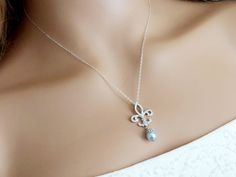 Fleur-De-Lis Cubic Zirconia Light Blue Pearl Silver Bridal Pendant Necklace with .925 Sterling Silver Chain. PLEASE READ ITEM DESCRIPTION and SHOP POLICIES before placing your order, and contact me with any questions! CHAIN is 18 inches (45.7cm) long. PENDANT is 1.29 inch (3.3cm) long. BRIDAL NECKLACES SECTION: https://www.etsy.com/shop/LanaChayka?ref=seller-platform-mcnav§ion_id=11638944 NECKLACES SECTION: https://www.etsy.com/shop/LanaChayka?ref=seller-platform-mcnav§ion_id=17026331 Elegant an Elegant Light Blue Necklace For Wedding, Elegant Light Blue Wedding Necklaces, Elegant Light Blue Jewelry For Wedding, Delicate Blue Necklace For Wedding, Elegant Blue Wedding Necklaces, Elegant Blue Wedding Necklace, Blue Wedding Necklace, Bridal Pendant Necklace, Blue Pearl Necklace