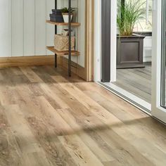 the inside of a house with wood floors and white walls