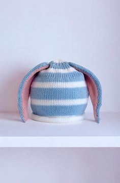 Cute blue baby hat with rabbit ears and white stripes | Cute blue baby hat with rabbit ears and white stripes- Small, Medium, or Large. Small- Up to 14" head circumference Medium- Up to 15" head circumference Large- Up to 16" head circumference | 1-800-Flowers Baby Toddler Baby Toddler Apparel Accessories Baby Headwear Accessories Baby Hats Caps Delivery Baby Hat W/ Stripes & Rabbit Ears - Blue - Set Of 3 (S, M, L) Headwear Accessories, Creative Background, Rabbit Ears, Blue Baby, Baby Hat, Head Circumference, 1 800, Baby Hats, Toddler Outfits