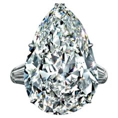 an oval cut diamond ring with three clawed shoulders