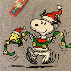 a snoopy christmas t - shirt is being drawn by someone