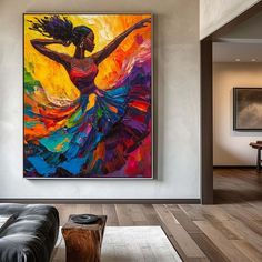 a large painting hanging on the wall in a living room