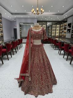 Elevate your bridal style with our stunning red lehenga adorned with mesmerizing crystal work. The radiant red hue and sparkling crystals create a captivating ensemble, exuding grace and glamour. Embrace the spotlight as you make a grand entrance, leaving a trail of timeless beauty on your wedding day. Fabric: Velvet WASH CARE INSTRUCTIONS - Please Dry clean only when it is applicable Ready to Ship! Festive Semi-stitched Heavy Lehenga, Red Heavy Lehenga For Festive Occasions, Festive Anarkali Heavy Lehenga, Red Embellished Lehenga For Festive Occasions, Heavy Red Dupatta With Traditional Drape, Festive Bollywood Heavy Lehenga, Traditional Heavy Red Dupatta, Heavy Red Lehenga For Diwali, Heavy Red Lehenga For Reception