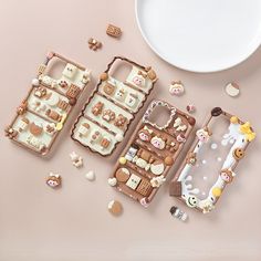 three pieces of food sitting on top of a pink surface next to a plate and bowl